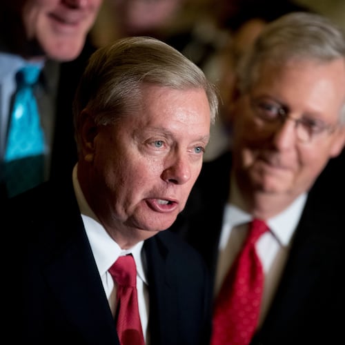 Sen. Lindsey Graham — pictured alongside Sen. Mitch McConnell in 2017 — died Saturday night of what the preliminary medical examiner report says was a tear in his aorta. (Andrew Harnik/AP)