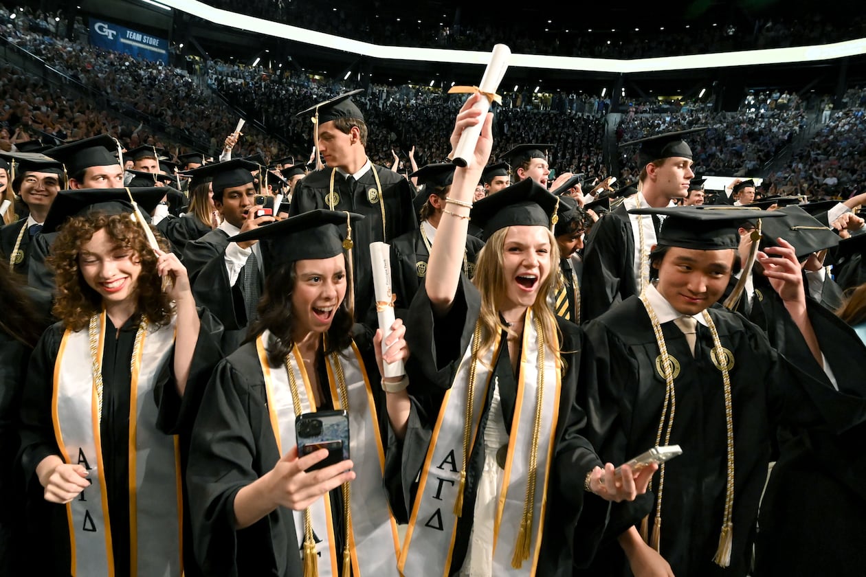 Georgia Tech graduates celebrate during spring commencement in May, and the school's growing enrollment helped contribute to the University System of Georgia recording record highs for degrees conferred this fiscal year. (Hyosub Shin/AJC)