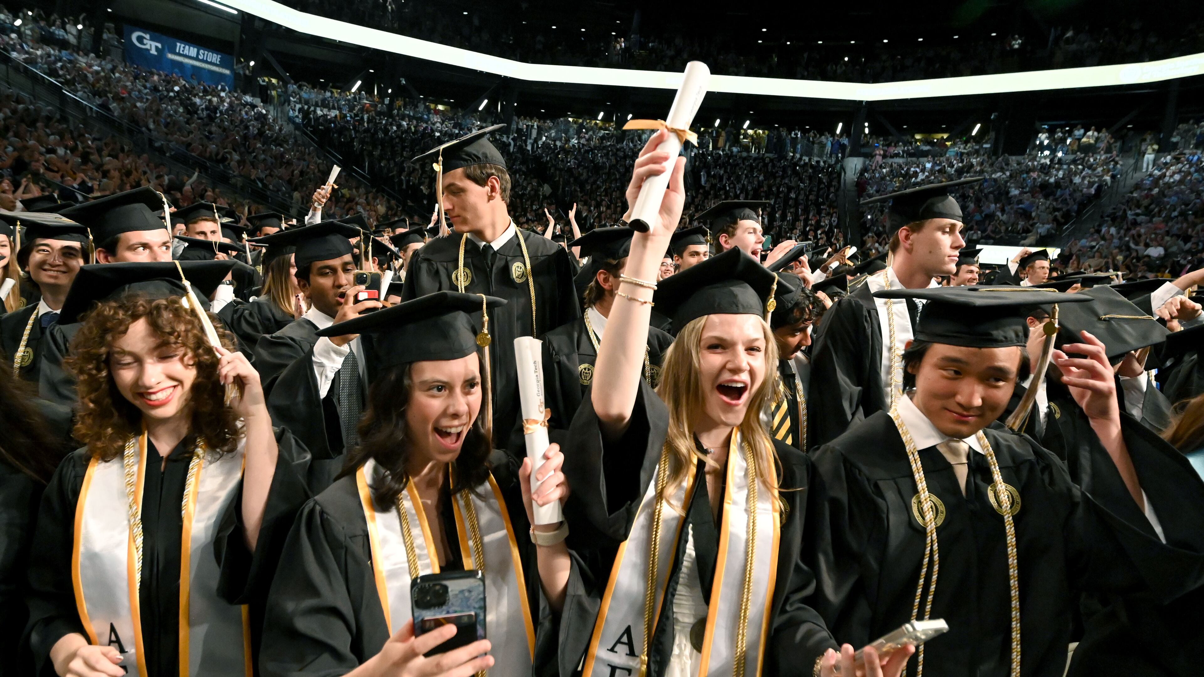 Georgia Tech graduates celebrate during spring commencement in May, and the school's growing enrollment helped contribute to the University System of Georgia recording record highs for degrees conferred this fiscal year. (Hyosub Shin/AJC)