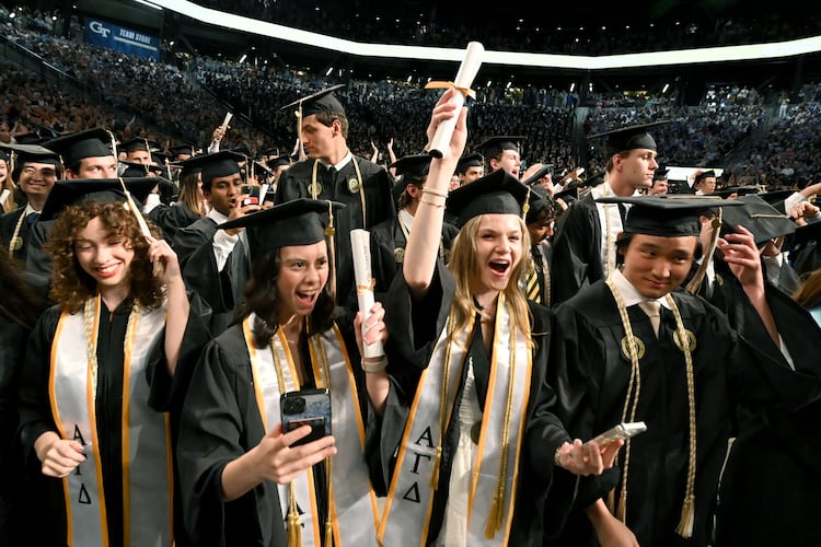 Georgia Tech graduates celebrate during spring commencement in May, and the school's growing enrollment helped contribute to the University System of Georgia recording record highs for degrees conferred this fiscal year. (Hyosub Shin/AJC)