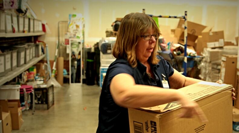 Paula Sands, assistant manager at the Franklin Walmart, became a Secret Santa’s sidekick Friday, Dec. 11, 2015, when she picked out toys and gifts to fulfill the benefactor’s request. (Jim Noelker/Staff)
