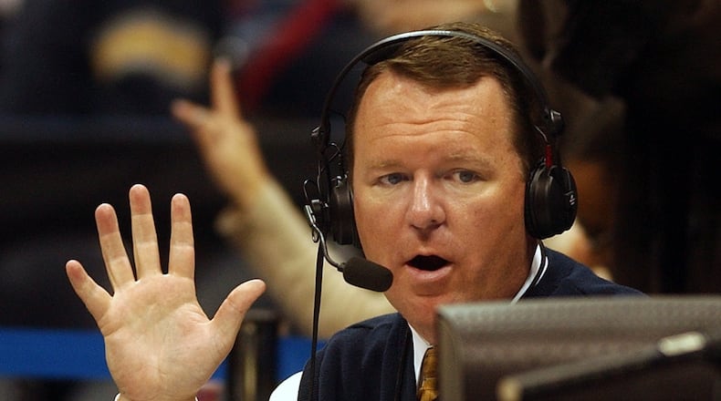 In this Dec. 11, 2004, photo Wes Durham gestures as he does the play by play for the Georgia Tech Yellow Jackets.