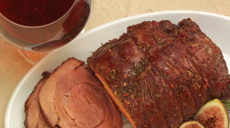 Sunday’s Pomegranate Roasted Leg of Lamb goes well with brussels sprouts and crusty bread. Contributed by American Lamb Board