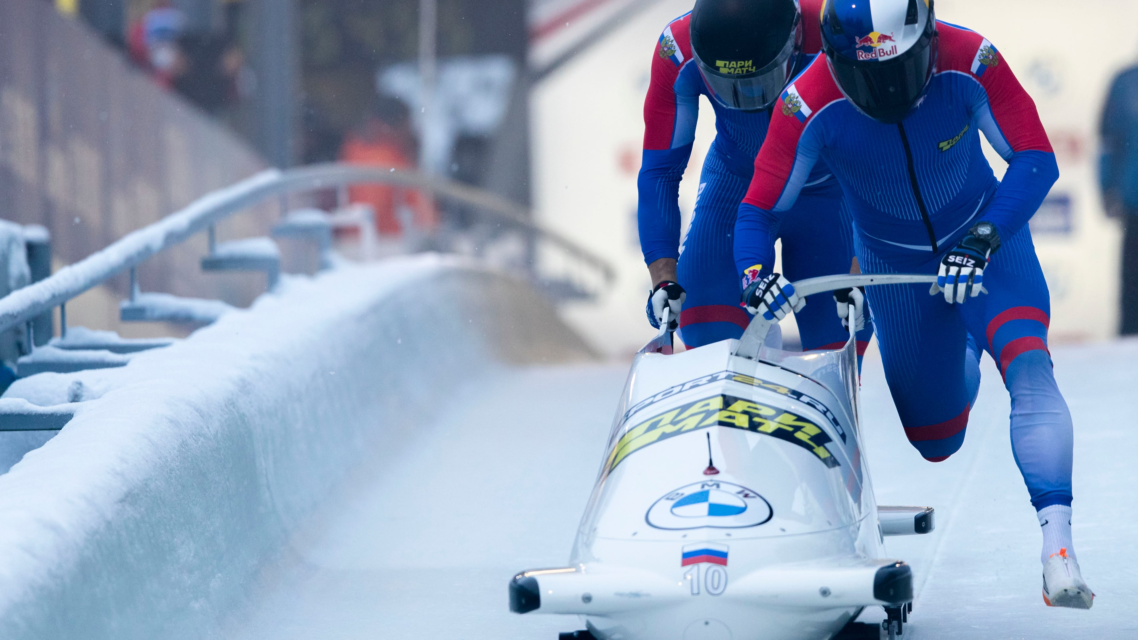 FILE - Rostislav Gaitiukevich and Mikhail Mordasov, from Russia, push at the start of the men's two-man bobsleigh World Cup race in Igls, near Innsbruck, Austria, Saturday, Nov. 27, 2021. (AP Photo/Lisa Leutner, File)