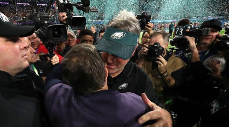 Head coach Doug Pederson of the Philadelphia Eagles shakes hands with head coach Bill Belichick after defeating the New England Patriots 41-33 in Super Bowl LII at U.S. Bank Stadium on February 4, 2018 in Minneapolis, Minnesota. (Photo by Patrick Smith/Getty Images)