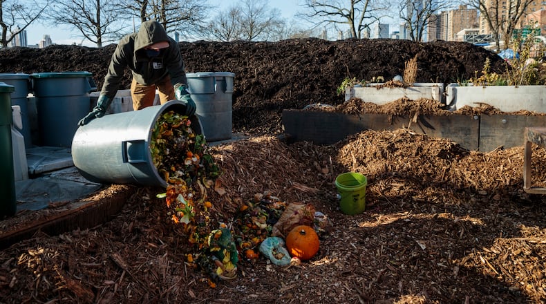 **EMBARGO: No electronic distribution, Web posting or street sales before WEDNESDAY 11:50 P.M. ET JAN. 25, 2023. No exceptions for any reasons. EMBARGO set by source.** FILE — A worker sorts through food scraps at the East River Compost Yard in Manhattan, on Dec. 15, 2020. A decade after Michael R. Bloomberg co-opted a line from “Star Trek” to declare composting the “final recycling frontier,” New York City is finally poised to unveil plans to implement what it is calling the nation’s largest composting program. (Sarah Blesener/The New York Times)