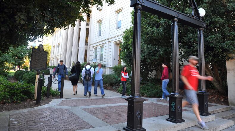 A student walks under the famed Arch on the University of Georgia campus.