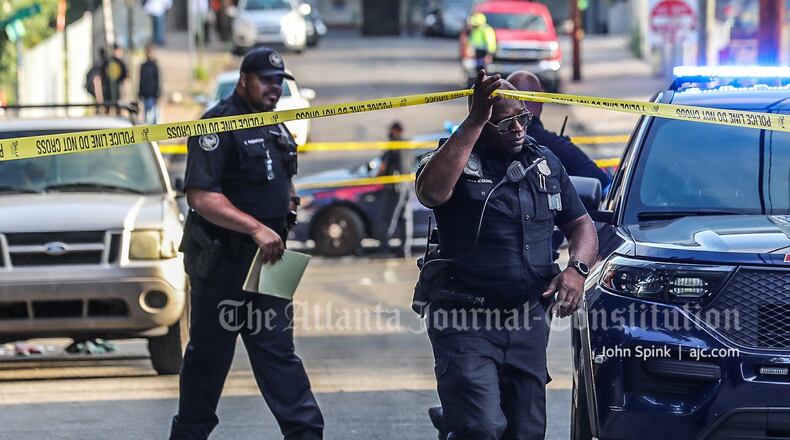 Police investigate a shooting that left one man dead and another injured Friday morning in southeast Atlanta's Sweet Auburn neighborhood.