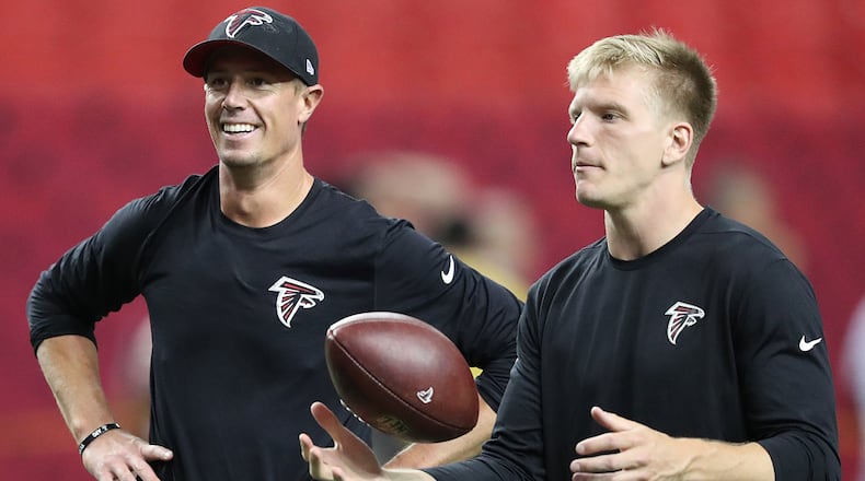 Matt Ryan is all smiles as Falcons quarterback Matt Simms prepares to pass before playing the Redskins in an exhibition game Thursday, August 11, 2016, in Atlanta.
