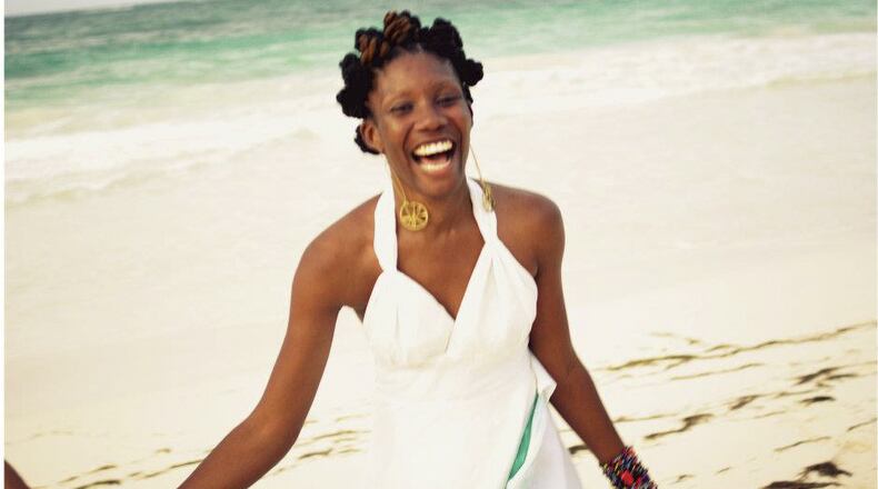 An undated handout photo of the writer Nicole Dennis-Benn in her native Jamaica. Dennis-Benn’s debut novel “Here Comes the Sun,” explores class and race in her homeland. (Kwesi Abbensetts via The New York Times)