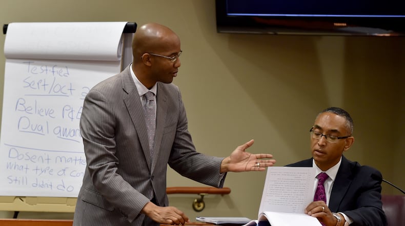 District Attorney Robert James asks DeKalb County CEO Burrell Ellis to review prior testimony on June 23, 2015. The Georgia Supreme Court reversed Ellis’ conviction Wednesday. BRANT SANDERLIN/BSANDERLIN@AJC.COM