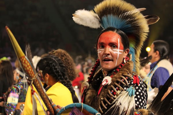 Native American and Indigenous dancers take part in a grand entry procession at the annual Gathering of Nations powwow in Albuquerque, New Mexico, on Friday, May 25, 2025 (AP Photo/Susan Montoya Bryan)