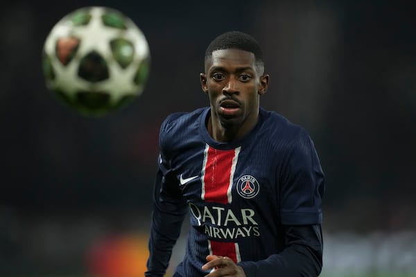 PSG's Ousmane Dembele runs for the ball during the Champions League round of 16 first leg soccer match between Paris Saint-Germain and Liverpool in Paris, France, Wednesday, March 5, 2025. (AP Photo/Christophe Ena)