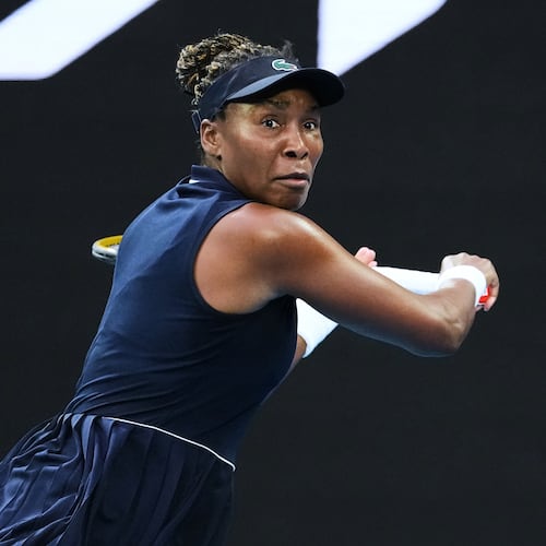 FILE - Venus Williams, of the United States, plays a backhand return to Olga Danilovic, of Serbia, during their first round match at the Australian Open tennis championship in Melbourne, Australia, Jan. 18, 2026. (AP Photo/Aaron Favila, File)