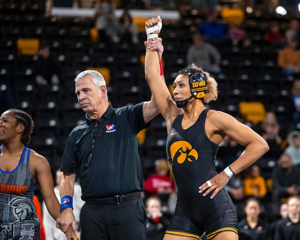 FILE - Iowa's Kennedy Blades is declared the winner after wrestling Indiana Tech's Cydney Bassett at 160 pounds during Day 1 of the Soldier Salute wrestling tournament at the Xtream Arena in Coralville, Iowa, on Sunday, Dec. 29, 2024. (Nick Rohlman/The Gazette via AP, File)