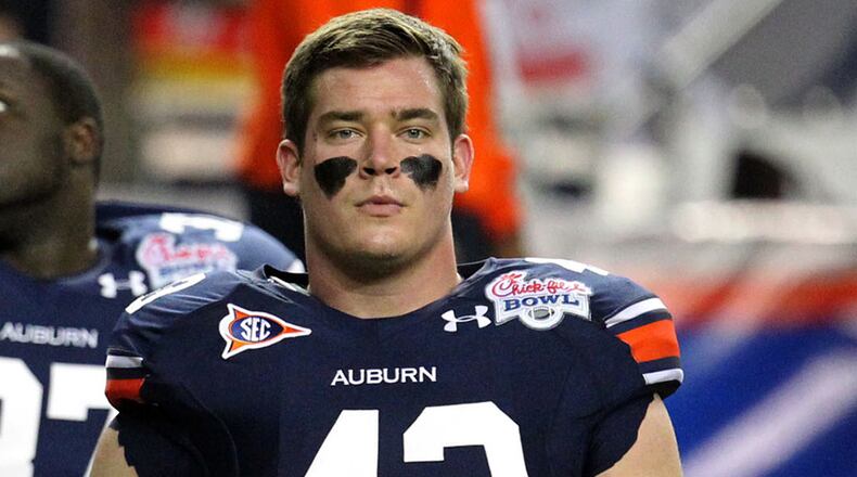 Philip Lutzenkirchen (43), a star at Auburn, attended Lassiter High School in Marietta. (Jason Getz / AJC File)