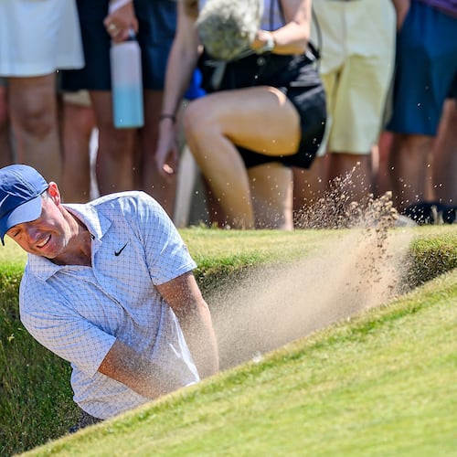Rory McIlroy, of Northern Ireland, plays from a bunker on the ninth fairway during day one of the Genesis Scottish Open 2026 at The Renaissance Club in North Berwick, Scotland, Thursday, July 9, 2026. (Malcolm Mackenzie/PA via AP)