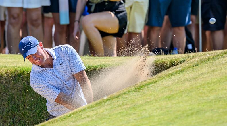 Rory McIlroy, of Northern Ireland, plays from a bunker on the ninth fairway during day one of the Genesis Scottish Open 2026 at The Renaissance Club in North Berwick, Scotland, Thursday, July 9, 2026. (Malcolm Mackenzie/PA via AP)