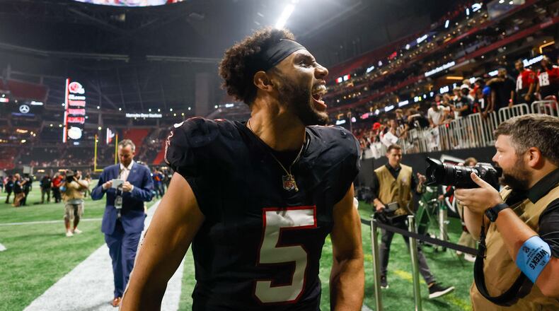 Atlanta Falcons wide receiver Drake London (5) reacts with the fans as he leaves the field after defeating the Tampa Bay Buccanneers 36-30 in overtime on Thursday, October 3, 2024, at Mercedes-Benz Stadium in Atlanta.
(Miguel Martinez/ AJC)