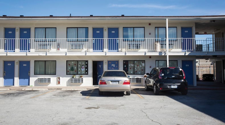 Christmas decorations adorn two motel windows and doors in this file photo.