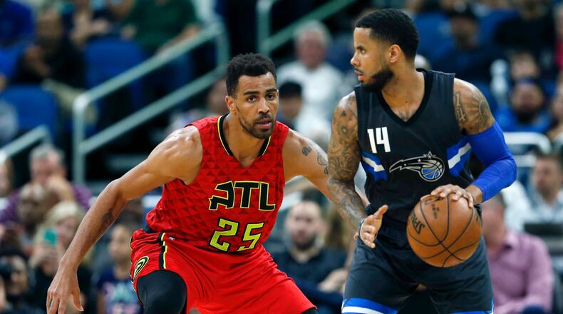 Atlanta Hawks forward Thabo Sefolosha (25) guards Orlando Magic guard D.J. Augustin (14) during the second half of an NBA basketball game in Orlando, Fla., on Saturday, Feb. 25, 2017.The Magic won 105-86. (AP Photo/Reinhold Matay)