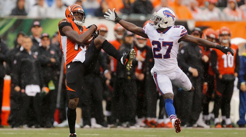 CINCINNATI, OH - OCTOBER 8: A.J. Green #18 of the Cincinnati Bengals catches a pass while being defended by Tre'Davious White #27 of the Buffalo Bills during the third quarter at Paul Brown Stadium on October 8, 2017 in Cincinnati, Ohio. (Photo by Michael Reaves/Getty Images)