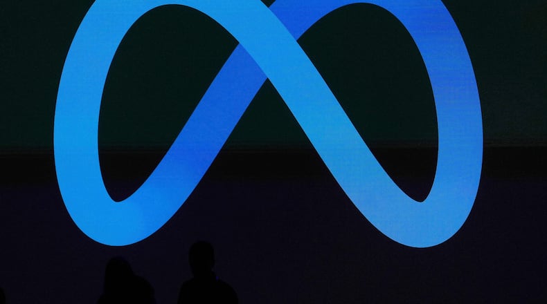 FILE - A Meta logo is shown on a video screen at LlamaCon 2025, an AI developer conference, in Menlo Park, Calif., April 29, 2025. (AP Photo/Jeff Chiu, File)