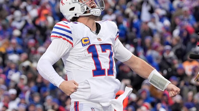 Buffalo Bills quarterback Josh Allen celebrates after scoring a touchdown against the Tampa Bay Buccaneers during the second half of an NFL football game, Sunday, Nov. 16, 2025, in Orchard Park, N.Y. (AP Photo/Carolyn Kaster)