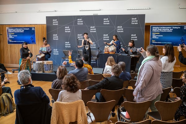 Rara Sekar, who goes by hara, right, performs at a session during the Skoll World Forum on Thursday, April 3, 2025, in Oxford, England. (AP Photo/Vickram Sombu)