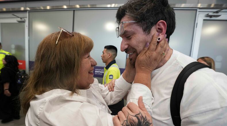Kyle Adler, a 36-year-old Chilean American who was taken from his family at nine months old and illegally adopted, embraces his birth mother, Ana Maria Navarrete, after traveling from the U.S. to meet her for the first time, in Santiago, Chile, Saturday, Feb. 14, 2026. (AP Photo/Esteban Felix)
