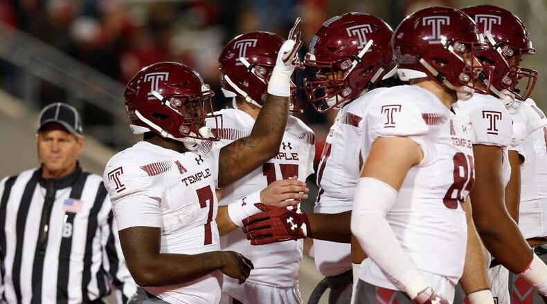 HOUSTON, TX - NOVEMBER 10: Ryquell Armstead #7 of the Temple Owls is congratulated by teammates after a rushing touchdown in the first half against the Houston Cougars at TDECU Stadium on November 10, 2018 in Houston, Texas. (Photo by Tim Warner/Getty Images)