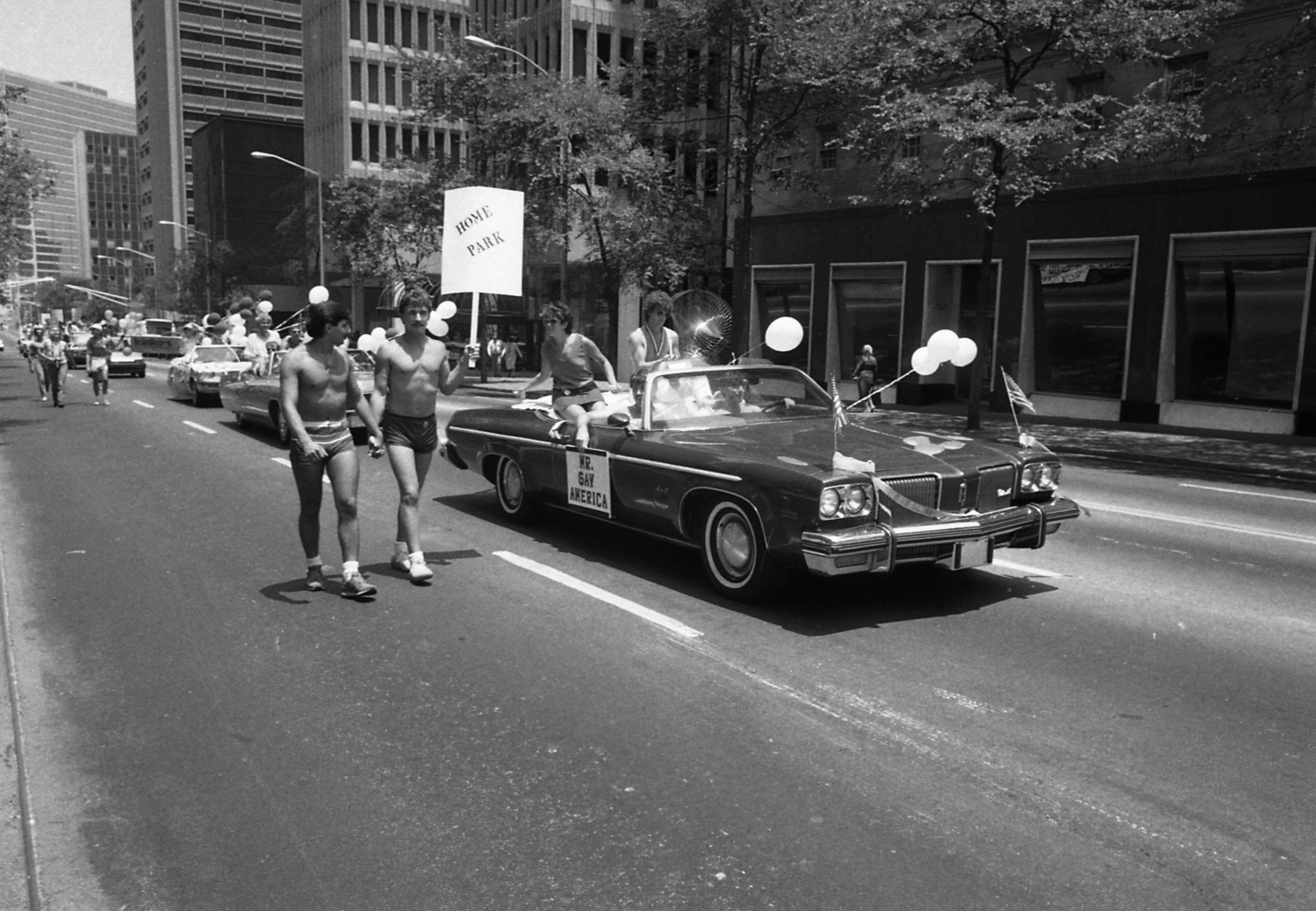 Participants in the "Mr. Gay America" car in the 17th annual Gay Pride Parade, Peachtree Street, Atlanta, June 21, 1986. (Atlanta Journal-Constitution Photographic Archives. Special Collections and Archives, Georgia State University Library.)