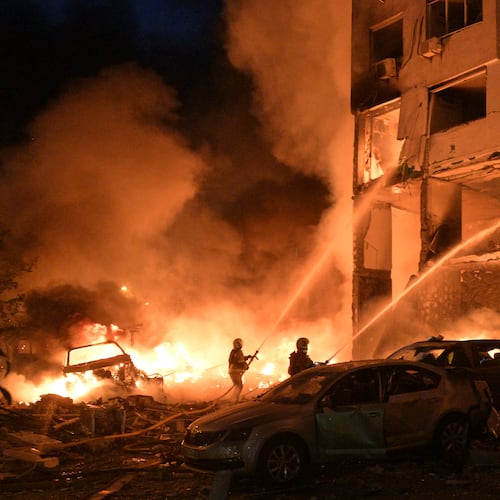 Emergency services personnel work to extinguish a fire following Russian missile attacks in Kyiv, Ukraine, Monday, July 6, 2026. (AP Photo/Danylo Antoniuk)