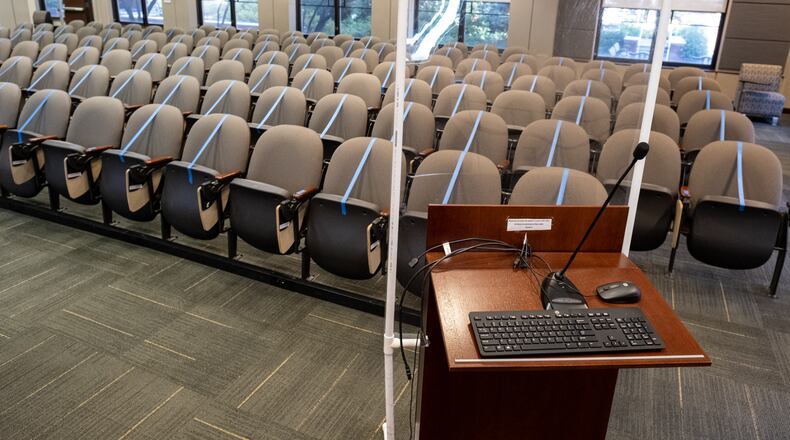 A presentation room in the Bill Moore Student Success Center at Georgia Tech has been converted from a 140-person theater to a 29-student classroom. Because the podium is not quite far enough away from the seats, an acrylic partition has been added for the instructor. Ben Gray for the Atlanta Journal-Constitution