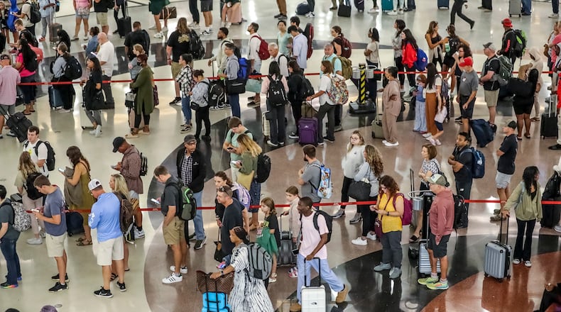 September 1, 2023 Atlanta: Hartsfield-Jackson International Airport’s domestic atrium was full of long lines of travelers waiting to go through security on Friday, Sept. 1, 2023. The holiday travel period running through the Tuesday after Labor Day will bring more than 300,000 passengers a day through the Atlanta airport on peak days and Friday was expected to be the busiest day of the Labor Day travel period, with 330,000 passengers passing through the Atlanta airport. That includes nearly 94,000 departing travelers that was expected at security checkpoints. For the Transportation Security Administration, passenger volumes through Hartsfield-Jackson checkpoints have made 2023 so far the busiest year on record, said Robert Spinden, TSA’s federal security director in Atlanta. Drivers taking road trips this Labor Day weekend will likely see gas prices similar to last year when the national average for a gallon of regular was $3.78. Prices at the pump won’t deter some drivers, including those who will begin the holiday weekend even earlier. Many travelers plan to escape from the heat. “Most travelers will leave on Thursday or Friday before Labor Day to take advantage of the long holiday weekend,” Paula Twidale, senior vice president of AAA Travel. “Domestically, the Pacific Northwest, big cities like New York and Denver, and tourist hotspots like Orlando and Las Vegas are the most popular. Internationally, it’s all about Europe and Canada.” For those taking road trips, plan ahead and leave early to avoid the congestion that will build as the weekend approaches, experts advise. And whether driving a vehicle or boat, remember to be well-rested and alert. (John Spink / John.Spink@ajc.com)