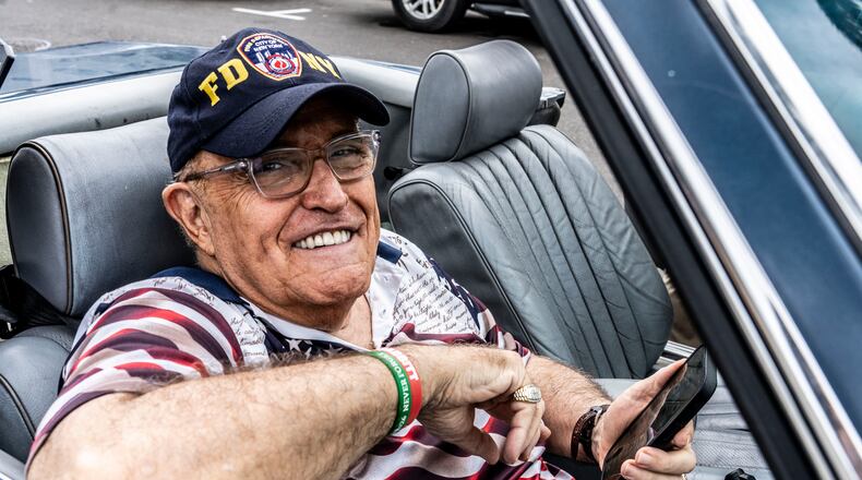 Rudy Giuliani sits outside a polling place in Palm Beach, Fla., on Tuesday, Nov. 5, 2024, in a Mercedes-Benz convertible that appears to be the vehicle he had been ordered to turn over to former Fulton County election workers Ruby Freeman and Shaye Moss. He has since surrendered the Mercedes but not the title to the car, it was disclosed at a recent court hearing. (Mark Peterson/NYT)