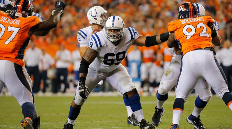 DENVER, CO - SEPTEMBER 07: Offensive guard Hugh Thornton #69 of the Indianapolis Colts defends the line of scrimmage for quarterback Andrew Luck #12 of the Indianapolis Colts against the Denver Broncos at Sports Authority Field at Mile High on September 7, 2014 in Denver, Colorado. The Broncos defeated the Colts 31-24. (Photo by Doug Pensinger/Getty Images)