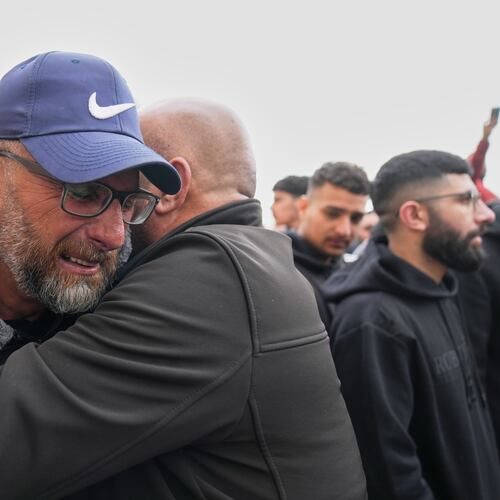 Mourners give condolences to Mohammad Abu Siyam, the father of Palestinian-American Nasrallah Abu Siyam, 19, who according to the Palestinian Health Ministry was shot by settlers on Wednesday night, during his funeral in the West Bank village of Mukhmas, east of Ramallah, Thursday, Feb. 19, 2026. (AP Photo/Nasser Nasser)