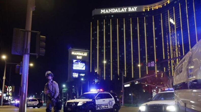 Police are arrayed outside the Mandalay Bay resort and casino after a mass shooting, Oct. 1. (AP Photo / John Locher)