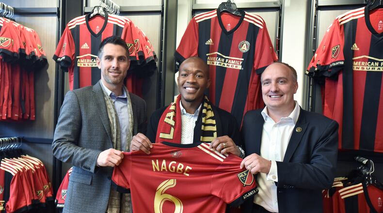 December 15, 2017 Atlanta - New Atlanta United midfielder Darlington Nagbe (center) poses with technical director Carlos Bocanegra (left) and Atlanta United President Darren Eales at the Team Store at Mercedes-Benz Stadium on Friday, December  on Friday, December 15, 2017. Atlanta United introduced midfielder Darlington Nagbe to the media on Friday at Mercedes-Benz Stadium. Hyosub Shin / hshin@ajc.com