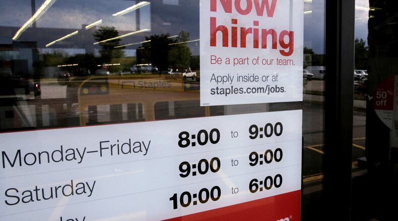 Holiday hiring was weaker than usual, but still enough to cap a decade-long expansion for Georgia with a record-low unemployment rate. (AP Photo/Steven Senne)