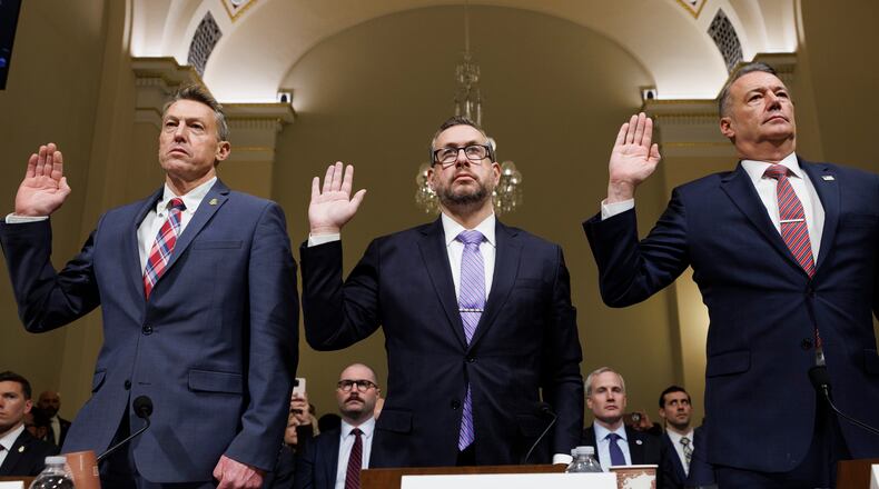 From left, Rodney Scott, commissioner of U.S. Customs and Border Protection, Joseph Edlow, director of U.S. Citizenship and Immigration Services and Todd Lyons, acting director of the U.S. Immigration and Customs Enforcement, are sworn in during a House Committee on Homeland Security oversight hearing of the Department of Homeland Security: ICE CBP and USCIS, on Capitol Hill, Tuesday, Feb. 10, 2026, in Washington. (AP Photo/Tom Brenner)