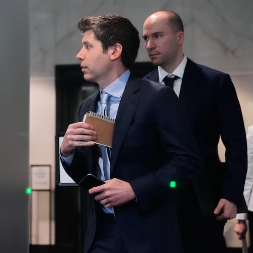 Sam Altman, center, and OpenAI president Greg Brockman, right, arrive at the U.S. District Court in Oakland, Calif., Thursday, April 30, 2026. (AP Photo/Godofredo A. Vásquez)