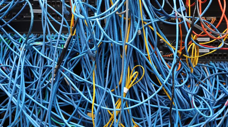 Network cables are plugged in a server room on November 10, 2014 in New York City. (Photo by Michael Bocchieri/Getty Images)