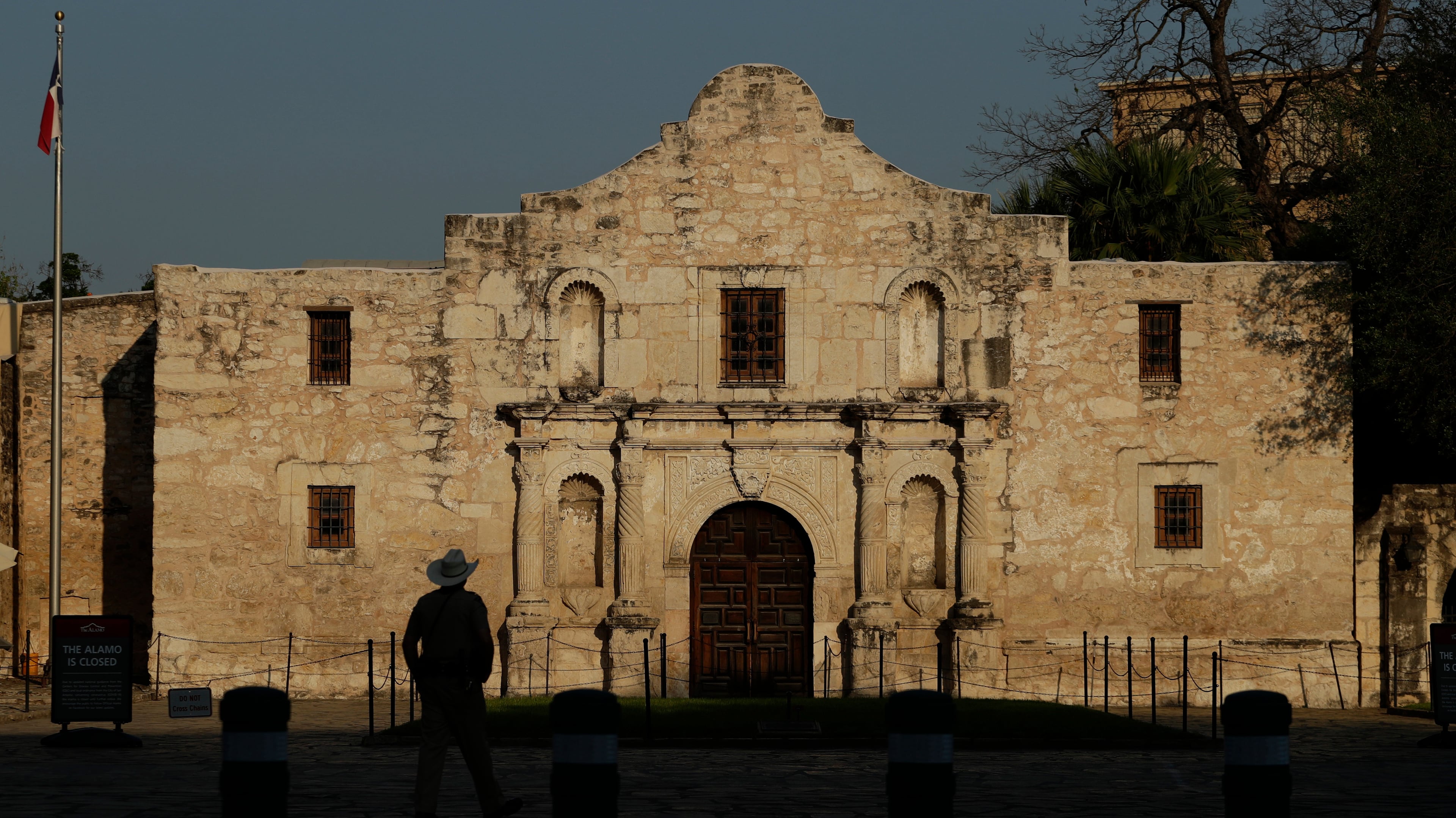 FILE - A ranger patrols the ground of the Alamo in San Antonio, Thursday, March 26, 2020.  (AP Photo/Eric Gay, File)