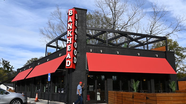 An exterior photo of Bankhead Seafood, which will officially open this Sunday, taken Wednesday, November 13, 2024, in Atlanta. The beloved Grove Park restaurant, located at 1651 Donald Lee Hollowell Parkway, shuttered in 2018 after 50 years in operation. Westside natives Killer Mike and T.I. are partners in the restaurant. (Hyosub Shin / AJC)