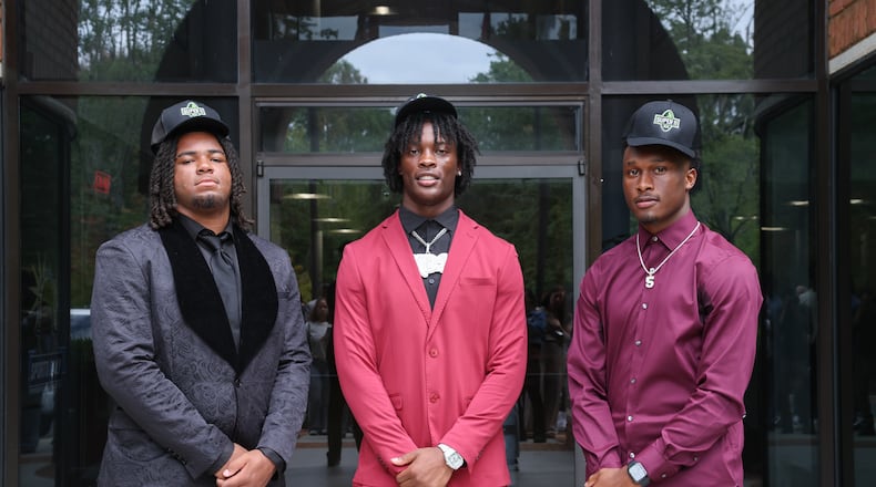 From left, AJC Super 11 selections Elijah Patmon of Northside, Kamarui Dorsey of Hampton and Jaden Upshaw of Lee County are all committed to play for Texas A&M. The last time three or more AJC Super 11 players signed with the same school was the 2023 Super 11 class. (Arvin Temkar/AJC)