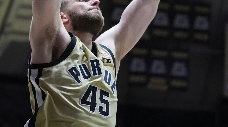 Purdue center Oscar Cluff (45) gets a basket on a dunk against Marquette during the second half of an NCAA college basketball game in West Lafayette, Ind., Saturday, Dec. 13, 2025. (AP Photo/Michael Conroy)
