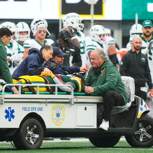 Green Bay Packers wide receiver Jayden Reed (11) is taken off the field following an injury during an NFL football game againt the New York Jets in East Rutherford, N.J., Sunday, Sept. 20, 2026. (AP Photo/Yuki Iwamura)