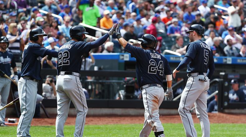 Kurt Suzuki of the Braves celebrates after hitting a three run home run against Matt Harvey of the New York Mets in the fourth inning. (Photo by Al Bello/Getty Images)